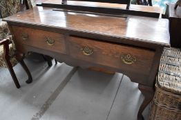 A period oak dresser base, having two deep frieze drawers, on cabriole legs, width approx. 144cm