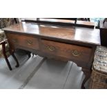 A period oak dresser base, having two deep frieze drawers, on cabriole legs, width approx. 144cm