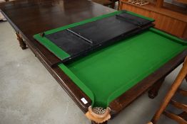 A traditional Riley snooker table, having accesories and dining top, appears quite low, probably
