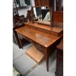 An Edwardian inlaid dressing table of classical design, having full width jewellery drawer based