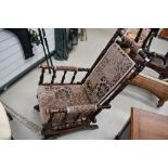 A Victorian stained frame Amercian style rocking chair