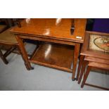 A mid 20th Century oak tea trolley havin folder over top, lined with green beize, approx closed