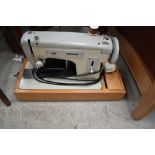 A vintage sewing machine in case, Merritt