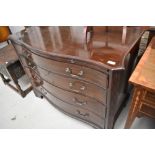 An early 20th Century mahogany serpentine chest of four drawers, and brushing slide, approx. Width