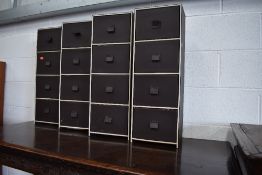 Four modern leatherette narrow drawer units