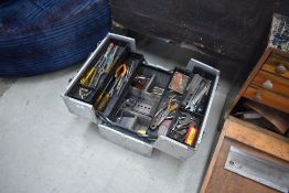 A metal cantilever toolbox and contents