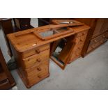 A modern pine twin pedestal dressing table having triptych mirror back, approx. width 138cm, would