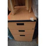 A modern beech laminate three drawer filing cabinet