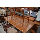 A nice quality vintage teak extending dining table and six (four plus two) chairs, Scandinavian