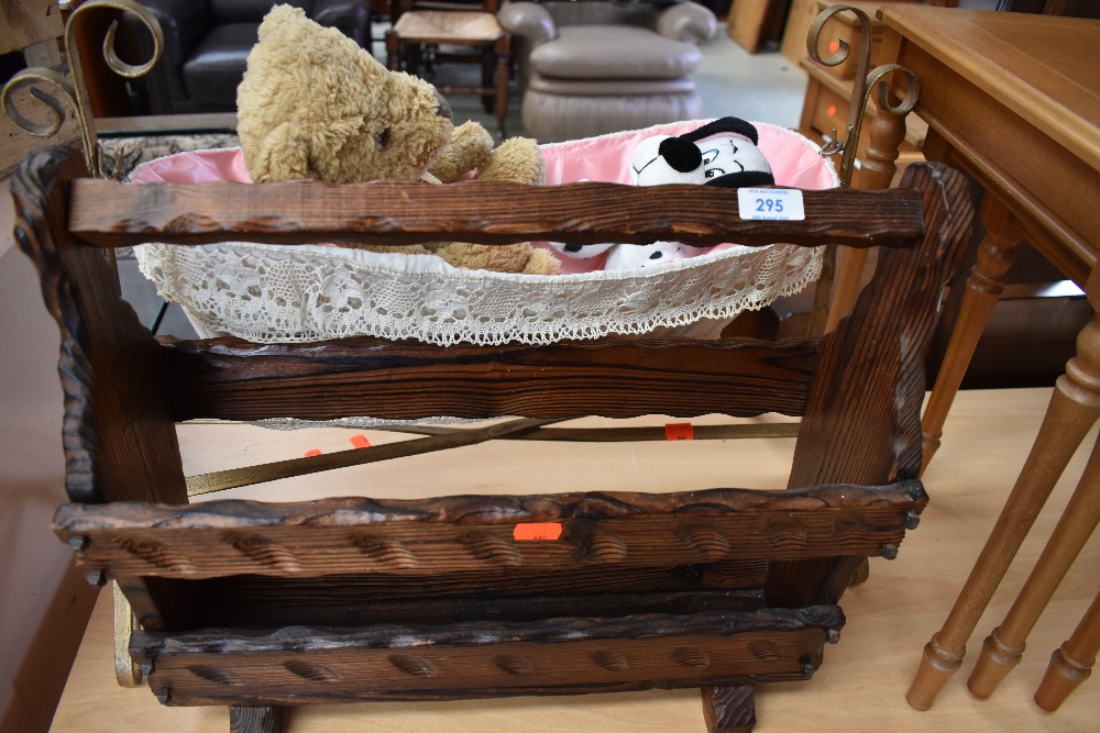 A rustic magazine rack and dolls rocking crib etc