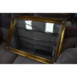 A large gilt frame over mantel style wall mirror, approx. 106 x 75cm