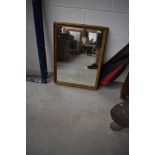 A traditional gilt frame plaster wall mirror, approx. 73 x 55cm