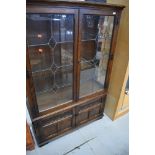 A modern oak bookcase with lower cupboard section, width approx. 108cm