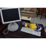 An Apple iMac desktop computer and accesories, serial number W8352078QB6