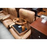 Two tan leather stressless armchairs and a footstool