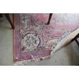 A large Chinese carpet square having pink ground , approx 300 x 214cm