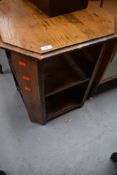 A mid 20th Century golden oak octagonal open bookcase/occasional table, approx width 53cm