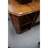 A mid 20th Century golden oak octagonal open bookcase/occasional table, approx width 53cm