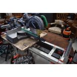 A roller style work bench and Hitachi mitre saw