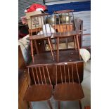 A set of four stained frame spindle back chairs, similar to Ercol