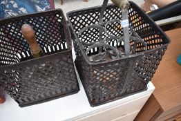 A selection of vintage items including bottle carrier, bell and metal baskets