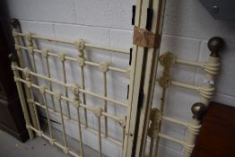 A cast bed frame in the Victorian style, width approx, 144cm