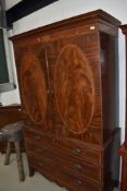An Edwardian mahogany and satinwood banded linen press, wardobe upper section over three long drawer