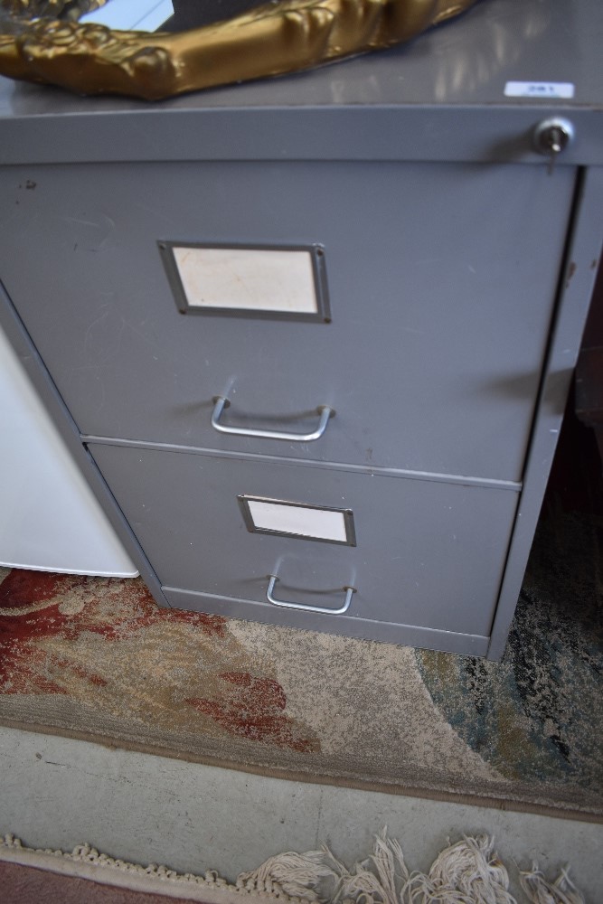 A vintage metal two drawer filing cabinet