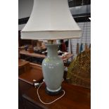 A large Oriental vase type floor or table lamp of jade green Oriental design, height of base approx.