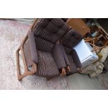 A pair of vintage dark stained teak armchairs, having original brown pin stripe upholstery, very