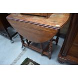 A mid 20th Century oak twist gateleg dining table, approx. width 91cm