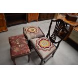 An early 19th century mahogany dining chair having shield back with later tapestry seat on