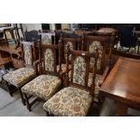 A top quality reproduction oak set of six (four plus two) dining chairs with floral upholstered