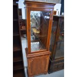 A reproduction yew wood display cabinet with single cupboard under, of narrow proportions, approx.