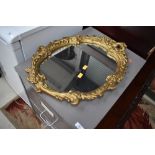 A plaster gilt rococo style mirror, approx height 61cm