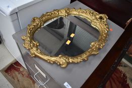 A plaster gilt rococo style mirror, approx height 61cm