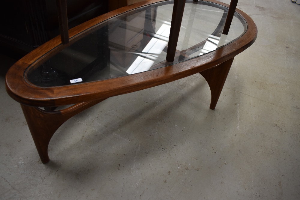 A vintage stained frame and glass coffee table of teardrop design, width approx. 132cm