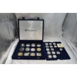 A collection of 26 Silver Commemorative coins of various size in fitted case