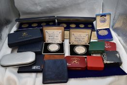A collection of World Silver Coins & Medallions in cases