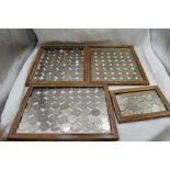 A collection of GB coins, fifty pence pieces and £2 pounds, in frames, fifty pences approximately