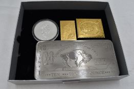 A 10 Troy Ounce Bar of Titanium, a 1996 1 oz Silver Canadian 5 Dollar Coin and two Silver Flags