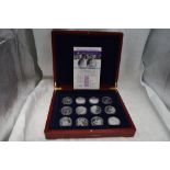 A collection of 12 Commonwealth 80th Birthday Silver crown sized coins, in fitted case