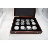 A collection of 24 Canadian 1 Dollar to 10 Dollar silver coins in wood case