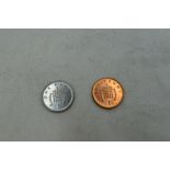 A 1999 GB copper plated steel One Penny, missing the copper plating in minting along with a