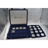 A collection of 17 USA silver Dollar coins including Liberty, 1oz etc in fitted case