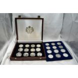 A collection of 24 Commonwealth Royalty silver coins in fitted wooden case