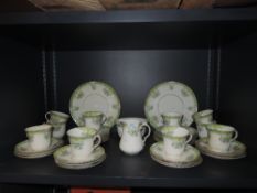 A part tea service by Sutherland art china with moulded cups enamel detailing and gilt edge work
