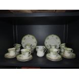 A part tea service by Sutherland art china with moulded cups enamel detailing and gilt edge work