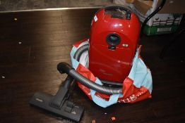 A Miele vacuum cleaner.