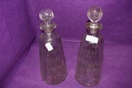 Two Victorian glass decanters, having etched detailing.
